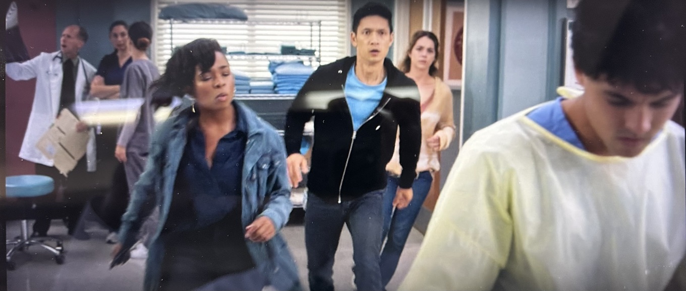 A hospital scene from Grey's Anatomy featuring Randy Loveridge in a doctor coat